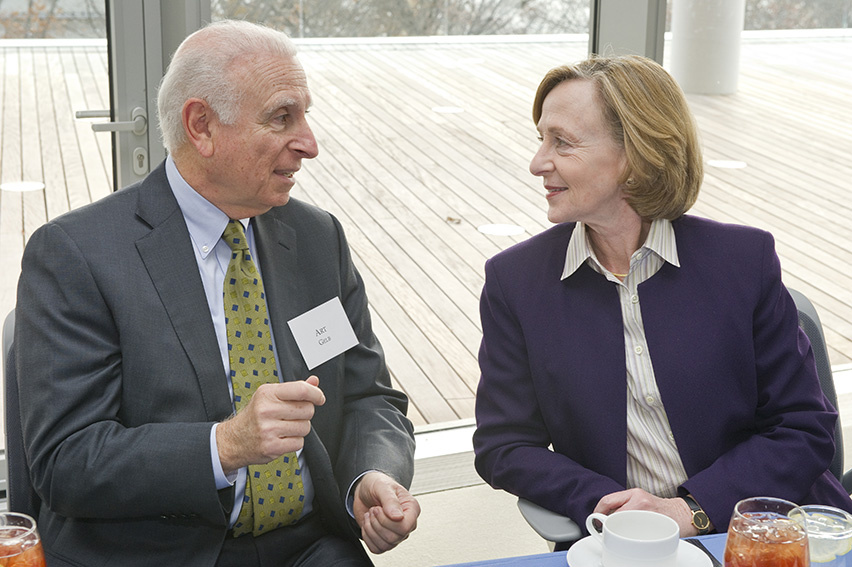 Man and woman conversing at table