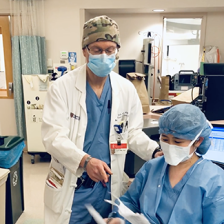 Yaffe conferring with a colleague at a hospital