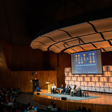 panel talk on stage at MIT Kresge Hall