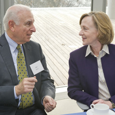 Man and woman conversing at table